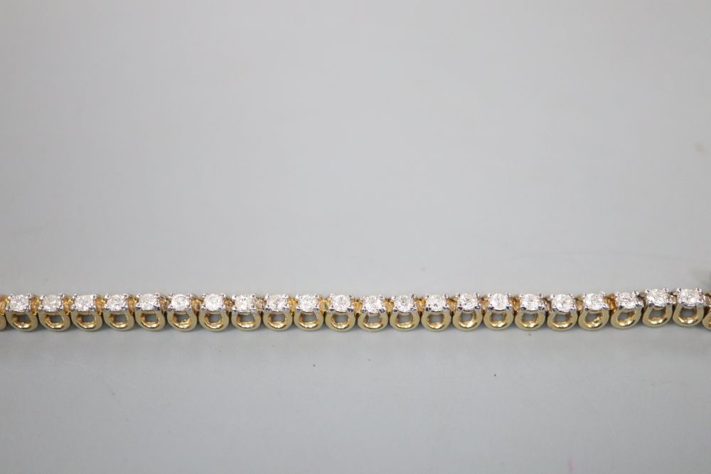 A modern 9ct gold and diamond set line bracelet, 17.7cm, gross 7 grams,